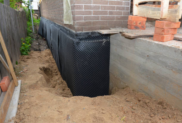 SJ Waterproofing Pros technician performing targeted Emergency Waterproofing assessment in Upper Sandusky, OH